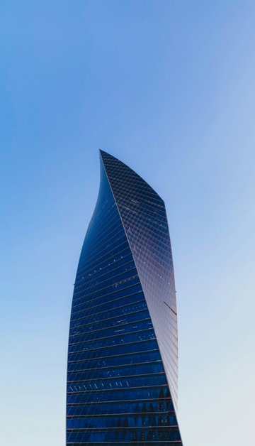 black-and-gray-high-rise-building-under-blue-sky-during-daytime.jpg black and gray high rise building under blue sky during daytime